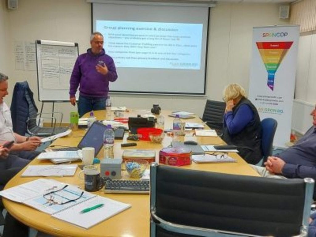 Steve Knapp leading a group planning discussion with a small leadership team