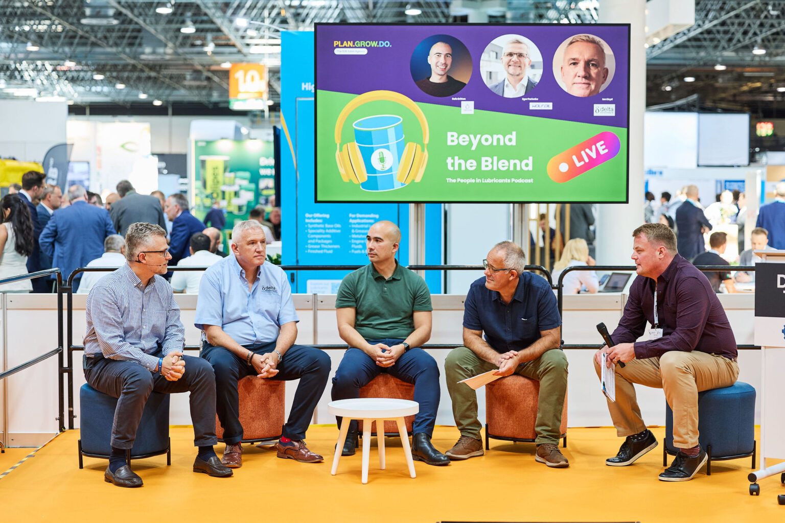 Beyond the Blend LIVE panel at Lubricant Expo Europe, industry guests seated in discussion in front of the Beyond the Blend screen